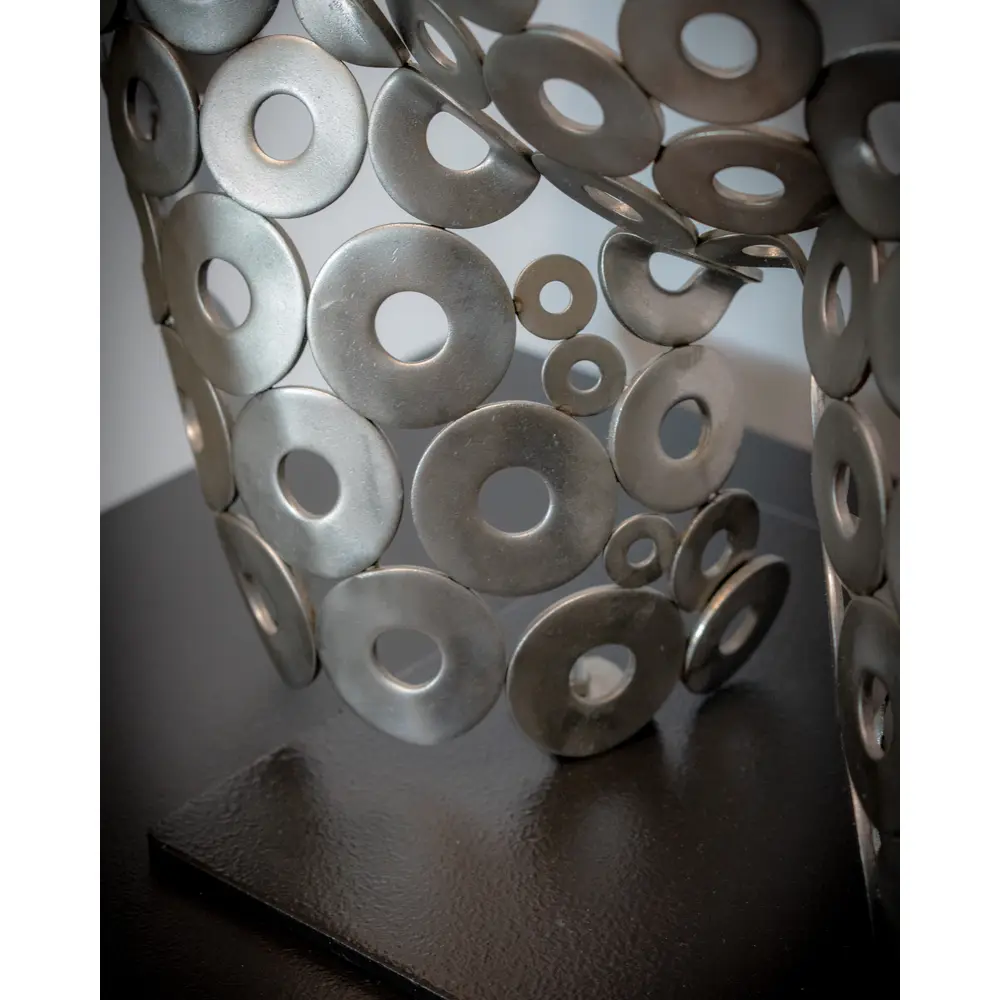 Close-up detail of hand-welded industrial steel rings - craftsmanship by Hard Deco