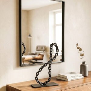 Small table decoration depicting the infinity symbol made of a metal chain.