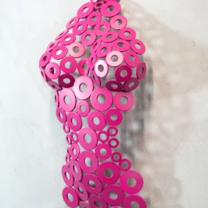 Modern wall-mounted sculpture of a female torso made from vibrant pink metal washers, creating a semi-transparent, textured form.